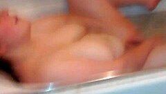 Gloria pleasures herself with dildo in steamy bathtub