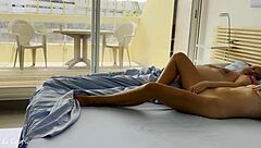 Wife watches nudists as husband wakes