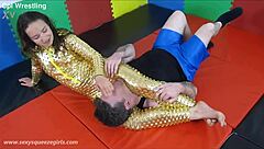 Bella's Golden Squeeze Headscissor Dominates Mixed Wrestling Match