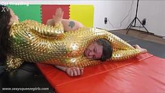 Bella's Golden Squeeze Headscissor Dominates Mixed Wrestling Match