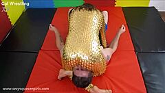 Bella's Golden Squeeze Headscissor Dominates Mixed Wrestling Match