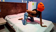 brunette in mask shakes sexy hips naked on halloween hotel bed