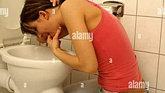 Puke Girl Fingers Pussy Desperately in Steamy Bathroom Scene