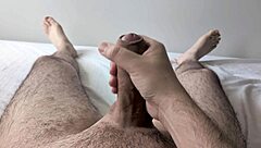 guy jerks big cock solo in bedroom close-up homemade style