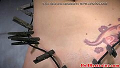 imagine tattooed sub bound, clamped, and whipped roughly close-up
