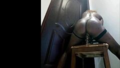 Big black ass in fishnets bounces wildly on thick cock