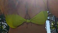 african exhibitionist flashes body drawing stares from guys on the beach