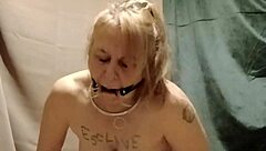 Bound slave masturbates with clips outdoor