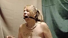 Bound slave masturbates with clips outdoor