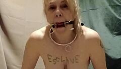 Bound slave masturbates with clips outdoor