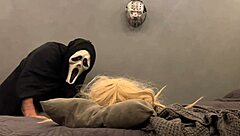 masked villain plays with halloween sex doll intimately