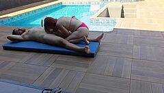 redhead rides thick cock by the pool