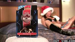 Big titted brunette plays with christmas toys!