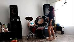 they play drums while she dances and strips her ass