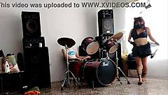 they play drums while she dances and strips her ass