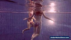 Horny girls strip eachother in the pool