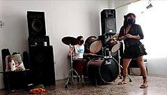 they play drums while she dances and strips her ass