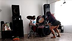 they play drums while she dances and strips her ass