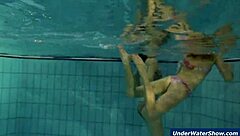 Horny girls strip eachother in the pool