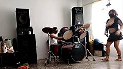 they play drums while she dances and strips her ass