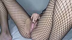 Skinny girl shows off in fishnets and lingerie