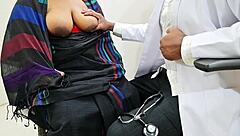 doctor examines patient boobs during medical checkup