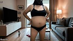 hijab pregnant doctor sits bored in her room