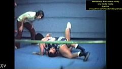Mixed wrestling match unfolds with intense physical competition