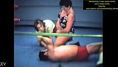 Mixed wrestling match unfolds with intense physical competition