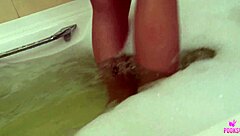Marigold Lets Water Run Over Bare Tits