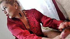 Mature bitch in red negligee sucks cock