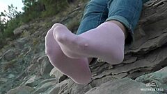 beautiful feet in socks shown outdoors
