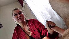 Mature bitch in red negligee sucks cock