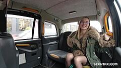 Blonde gives a hot handjob inside the taxi