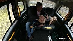 Blonde gives a hot handjob inside the taxi