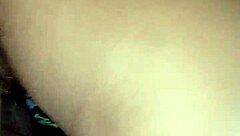 the young woman savors a delicious blowjob in the bedroom, her lips wrapped tightly around the throbbing cock as she takes it deep, moaning softly with each thrust from behind.