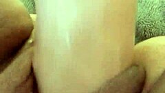 She masturbates with dildo for her man.