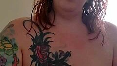 applying lotion to mature boobs