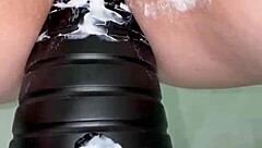 Amateur inserts anal tower dildo close up