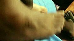 wife gives footjob to husband at home