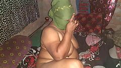 A sexy woman pleasuring herself by fingering her moist vagina