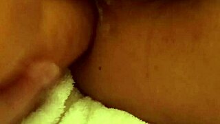 A girl uses a dildo to have sex with a man and gives him pleasure until he cums